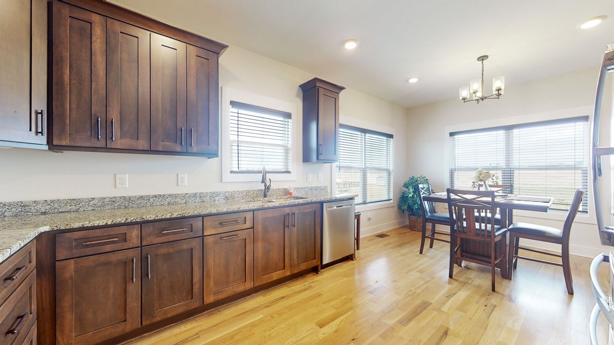 4817 Barren Plains Road Springfield, TN 37172 - Photo 4 of 13 a kitchen with granite countertop sink dining table and chairs