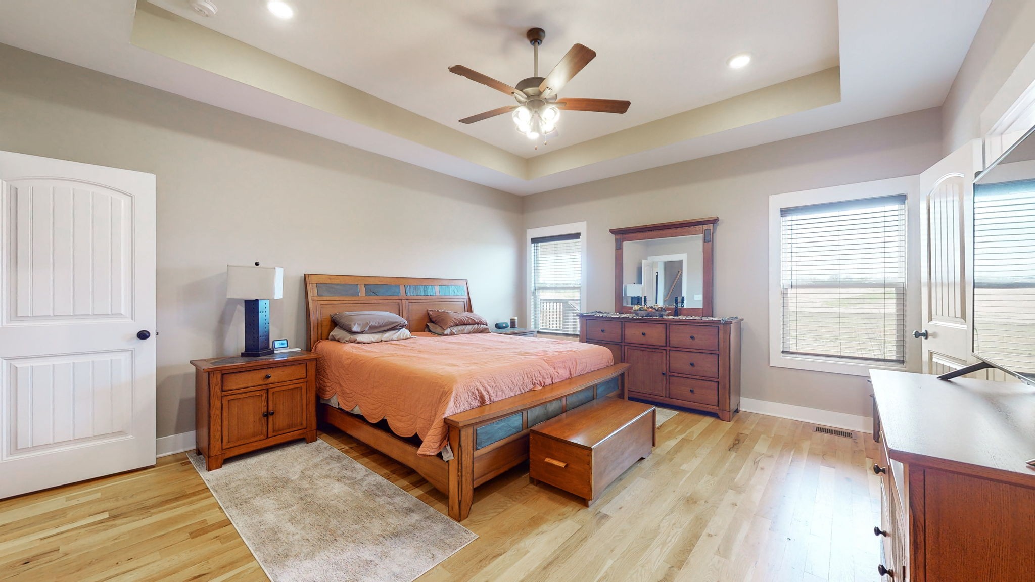 4817 Barren Plains Road Springfield, TN 37172 - Photo 5 of 13 a bedroom with a large bed a chandelier and a window