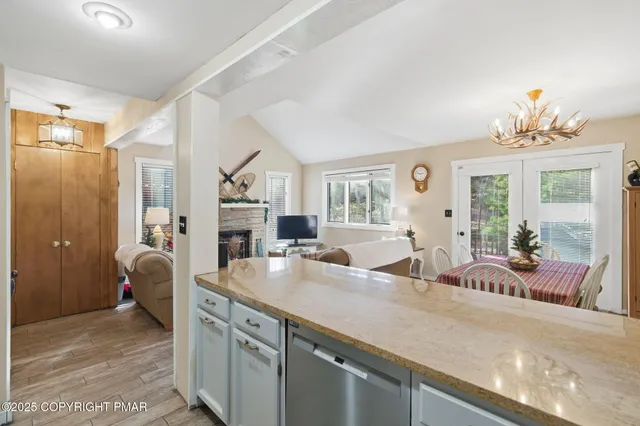 a view of staircase with railing and white walls