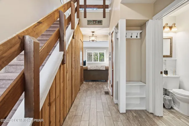 a bedroom with a bed next to a large window with the outer view