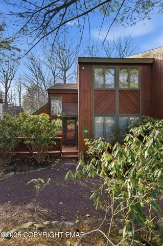a kitchen with stainless steel appliances granite countertop a sink stove refrigerator and cabinets