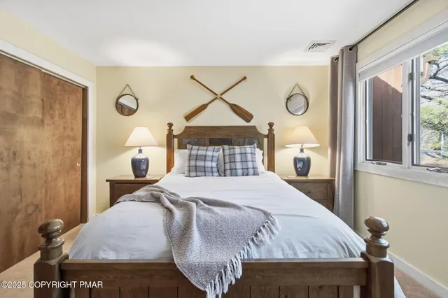 a view of river covered by trees and buildings