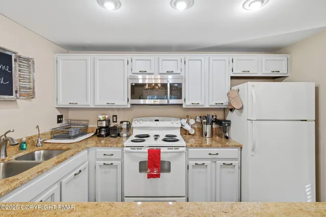 a living room with furniture a window and a fireplace