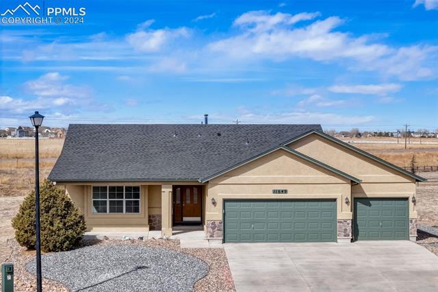 11649 Rio Secco Road Peyton, CO 80831 - Photo 36 of 42 Ranch-style house with a 3 car garage
