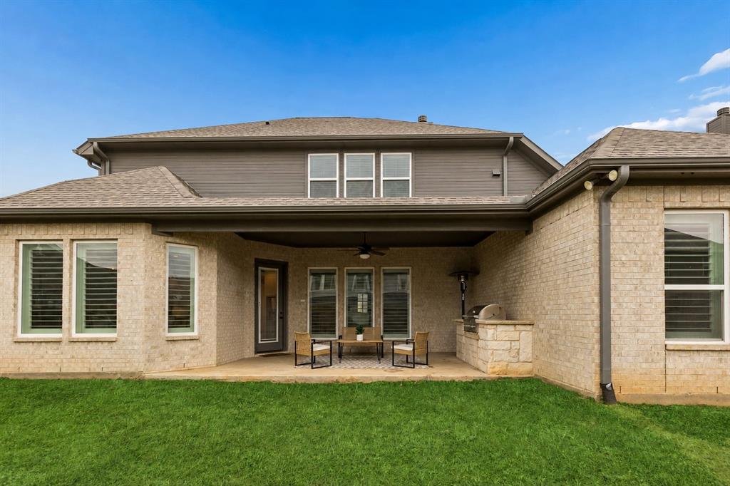 104 Ryder Court Hurst, TX 76053 - Photo 33 of 35 Covered Entertaining Space With Grill And Fireplace