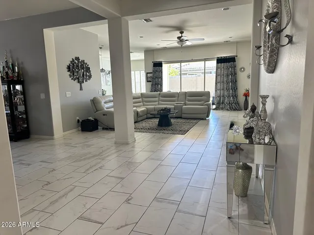 a view of a backyard with wooden fence