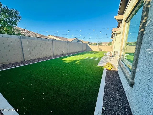 a view of a house with a yard porch and sitting area