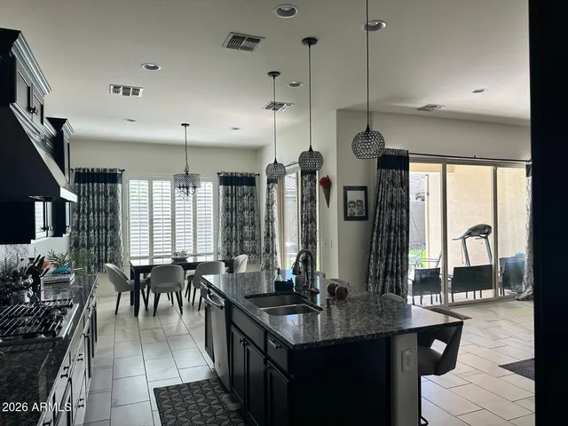 a kitchen with counter top space a sink cabinets and appliances