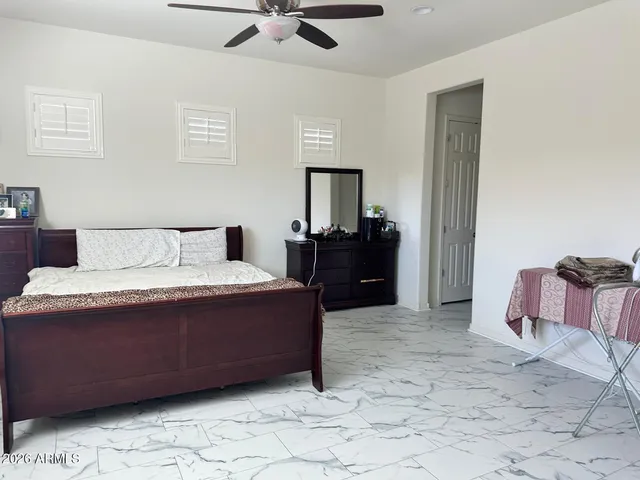 a bedroom with a bed and dresser