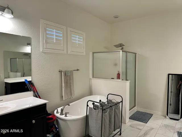 a bathroom with a toilet and a mirror