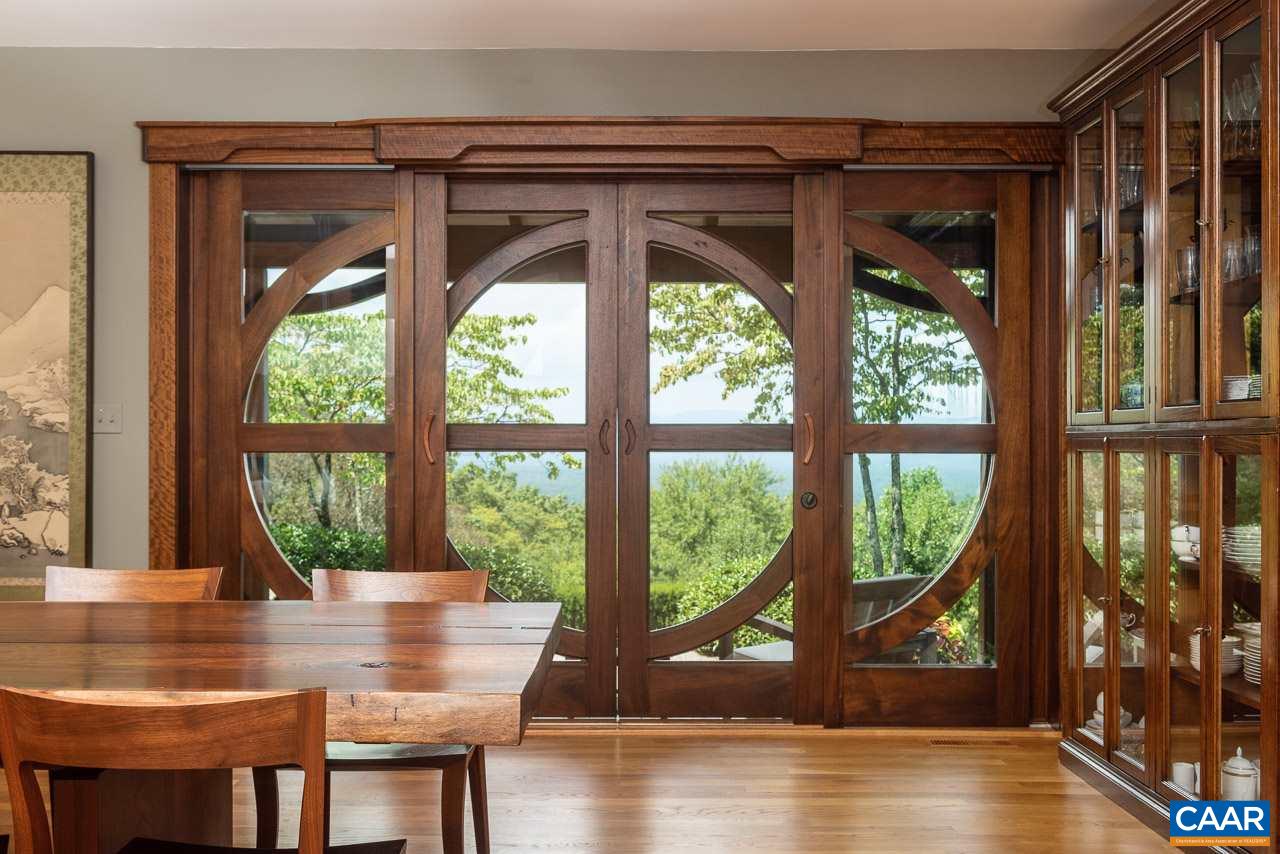 5400 Laurel Ridge Road Charlottesville, VA 22911 - Photo 12 of 49 a view of a dining room with furniture window and wooden floor