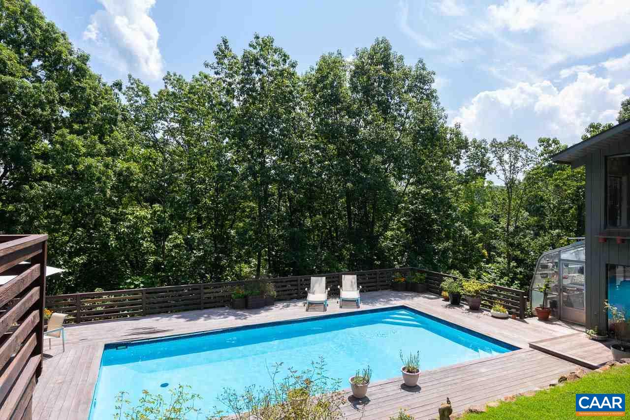 5400 Laurel Ridge Road Charlottesville, VA 22911 - Photo 34 of 49 a view of a chairs and table in the backyard