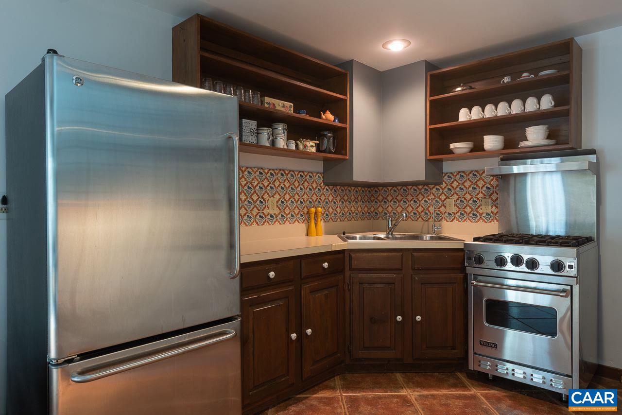 5400 Laurel Ridge Road Charlottesville, VA 22911 - Photo 41 of 49 a kitchen with stainless steel appliances granite countertop a stove a sink and a refrigerator