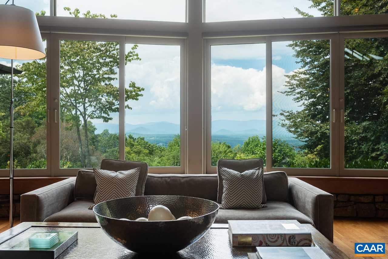 5400 Laurel Ridge Road Charlottesville, VA 22911 - Photo 8 of 49 a view of a patio with couches chairs and a potted plant