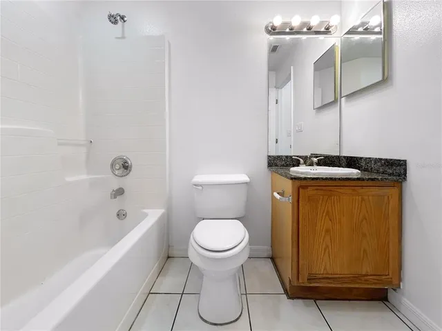 a bathroom with a toilet a sink and bathtub