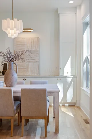 a kitchen with counter top space and living room