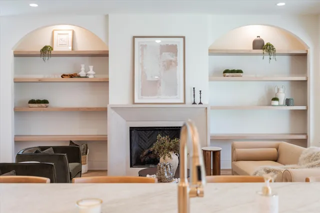 a kitchen with kitchen island stainless steel appliances a sink stove and refrigerator