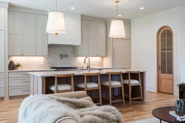 a view of a hallway with windows and stairs