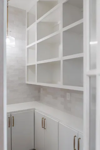 a bed room with a bed and a chandelier