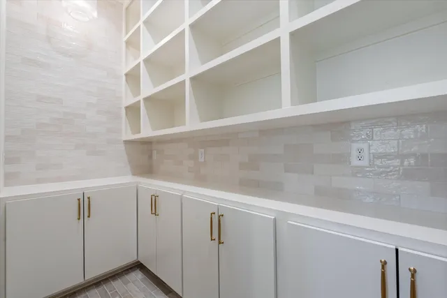 a white bath tub sitting next to a white sink