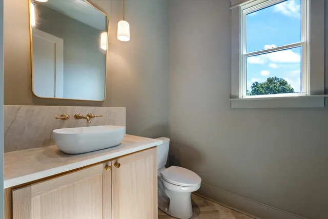 a kitchen with a sink cabinets and window
