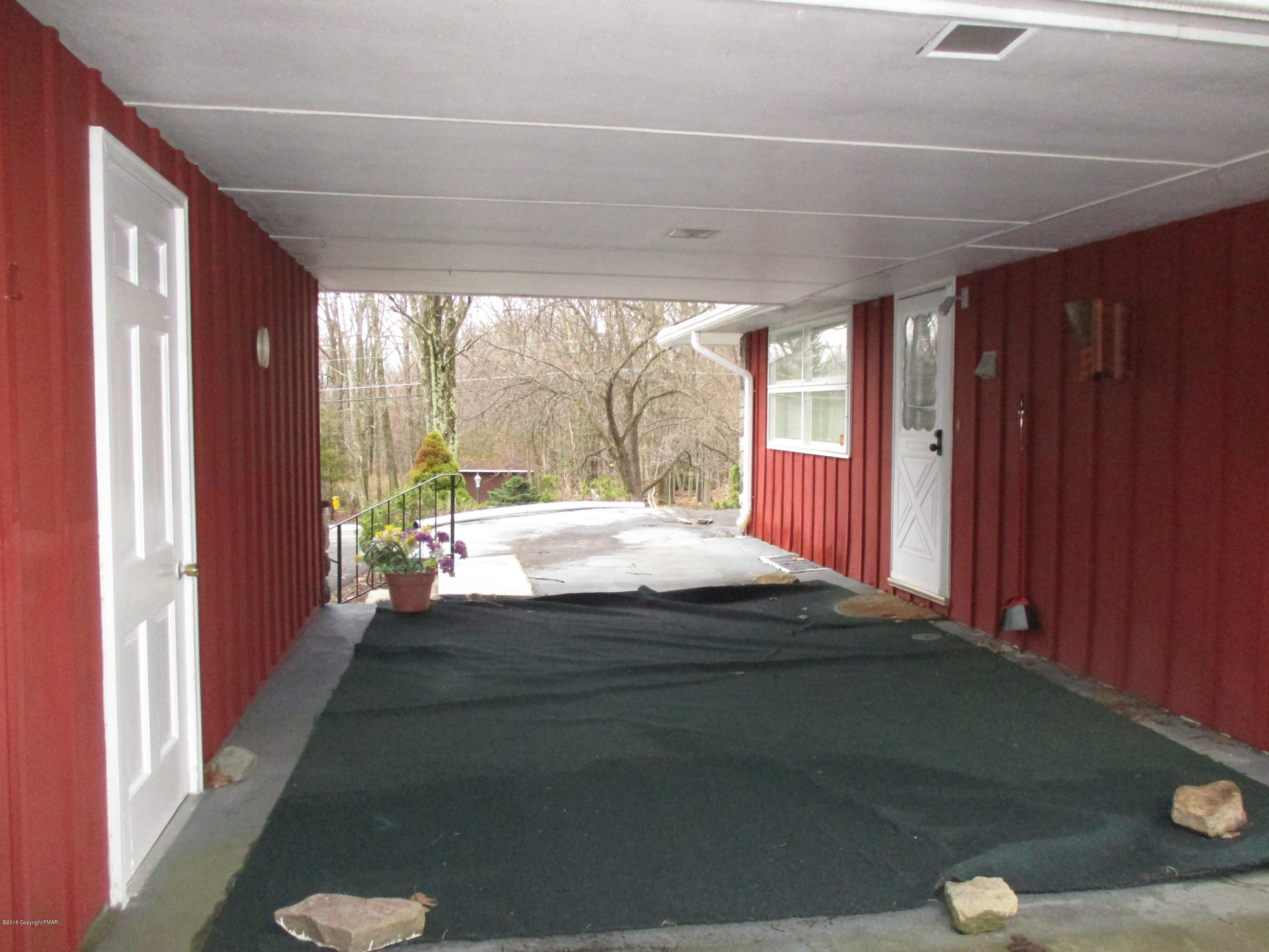 150 Winona Road Mount Pocono, PA 18344 - Photo 54 of 72 a bedroom with a bed and a large window