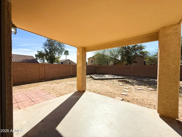 a view of a backyard of the house