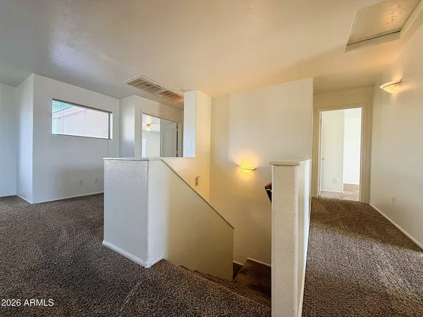 a view of hallway with livingroom
