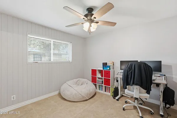 a room with furniture and musical instruments
