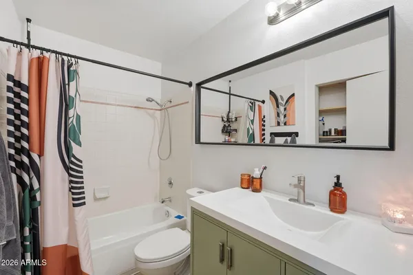a bathroom with a sink a toilet and a bathtub