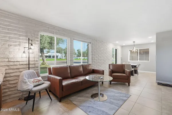 a living room with furniture and a large window