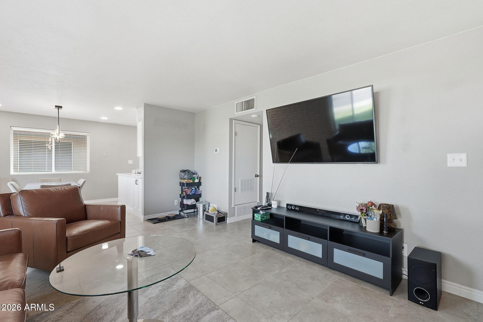 2015 East Southern Avenue, Unit 8 Tempe, AZ 85282 - Photo 8 of 33 a living room with furniture and a flat screen tv