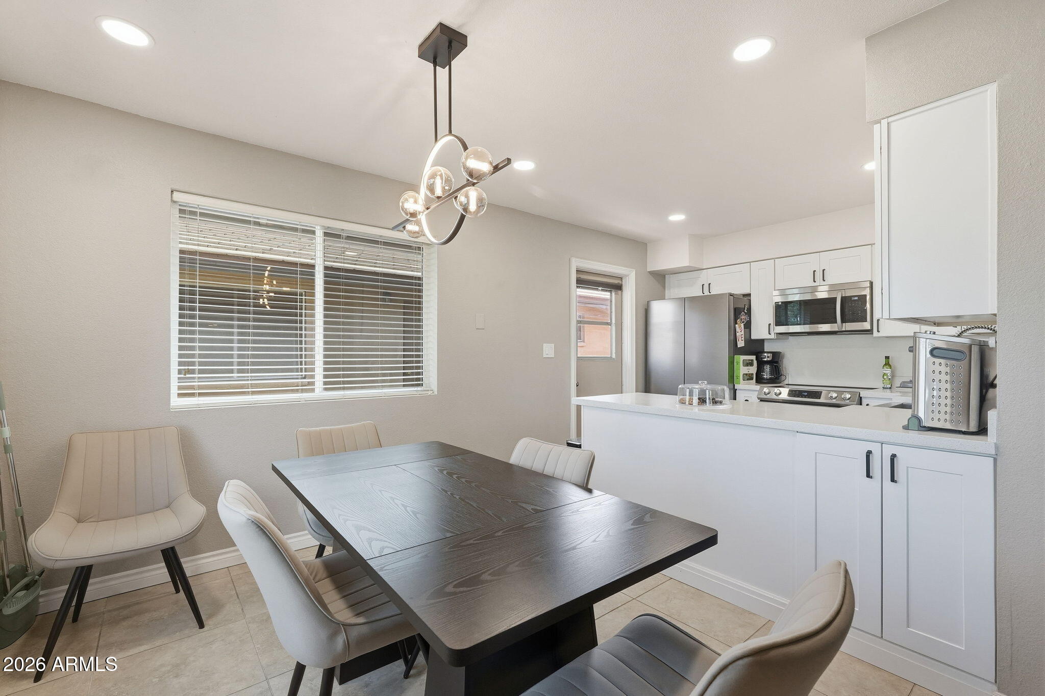 2015 East Southern Avenue, Unit 8 Tempe, AZ 85282 - Photo 10 of 33 a living room with stainless steel appliances kitchen island granite countertop furniture and a kitchen view