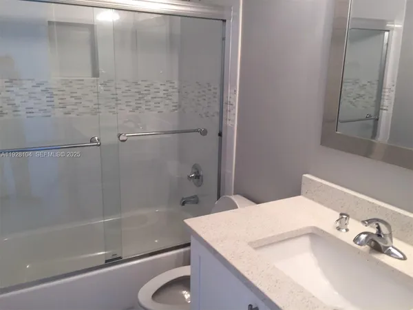 a bathroom with a sink and a bathtub