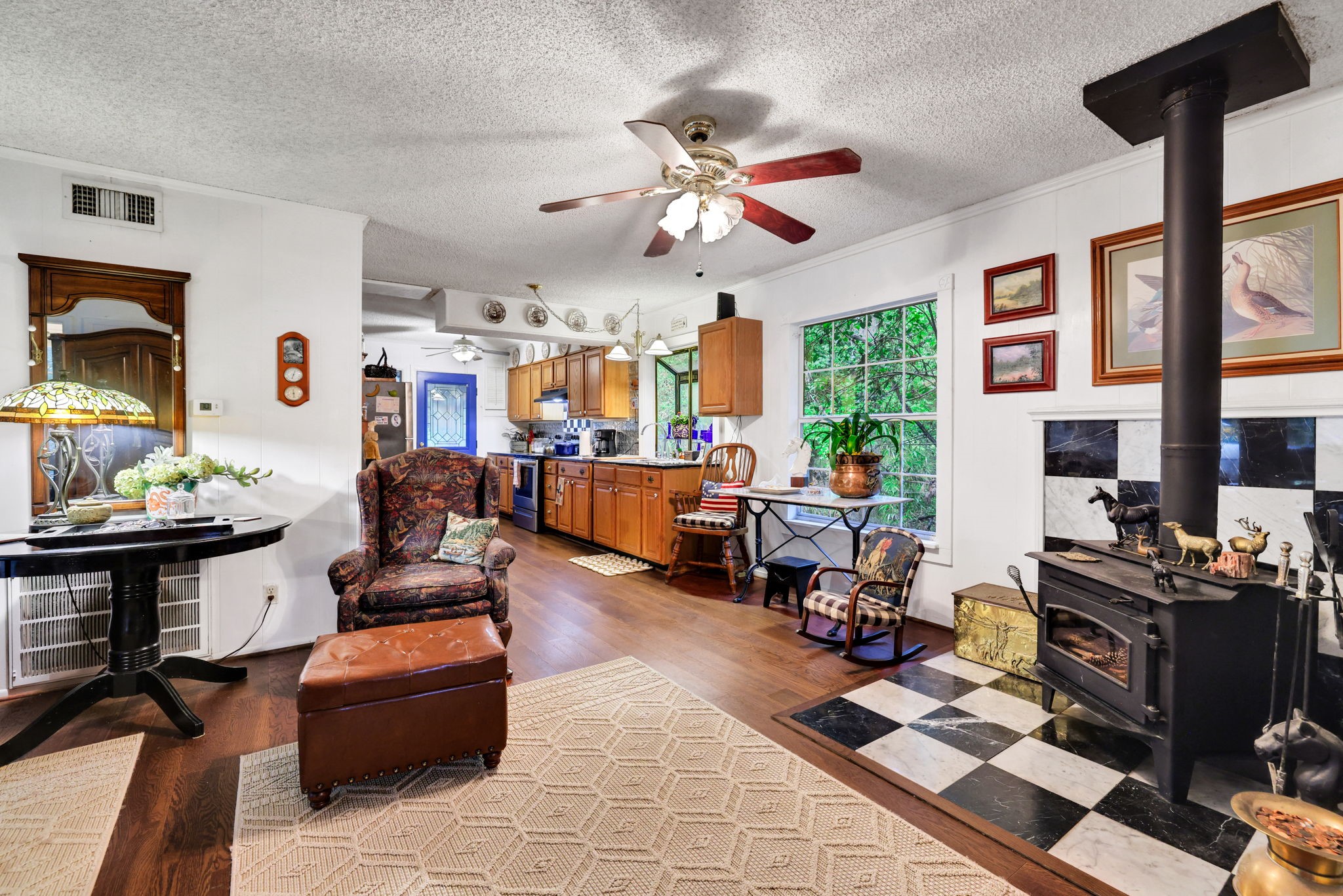 300 Timber Lane Coldspring, TX 77331 - Photo 11 of 43 a living room with furniture a flat screen tv and a dining table