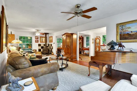 a view of a livingroom with furniture and toys