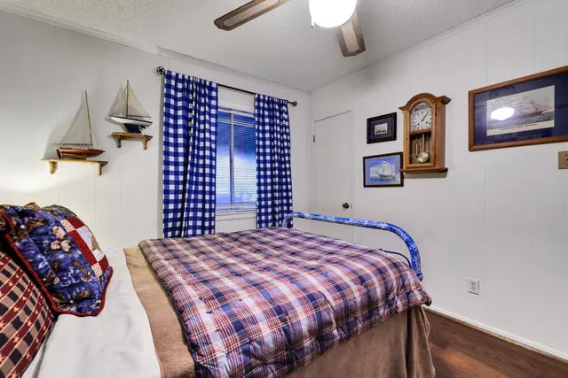 a bathroom with a sink a toilet and shower curtain