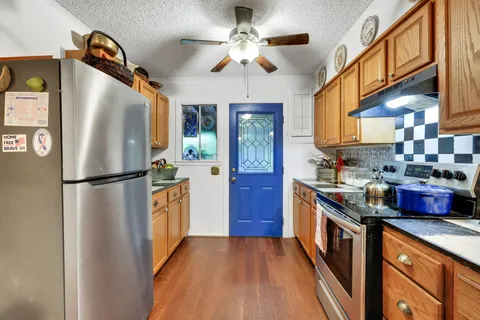 a kitchen with lots of counter top space and appliances