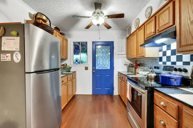 a kitchen with lots of counter top space and appliances