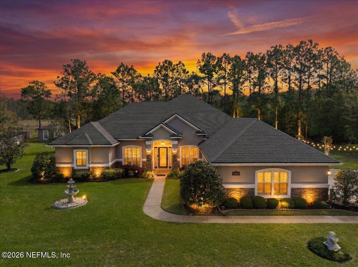 a front view of a house with a yard