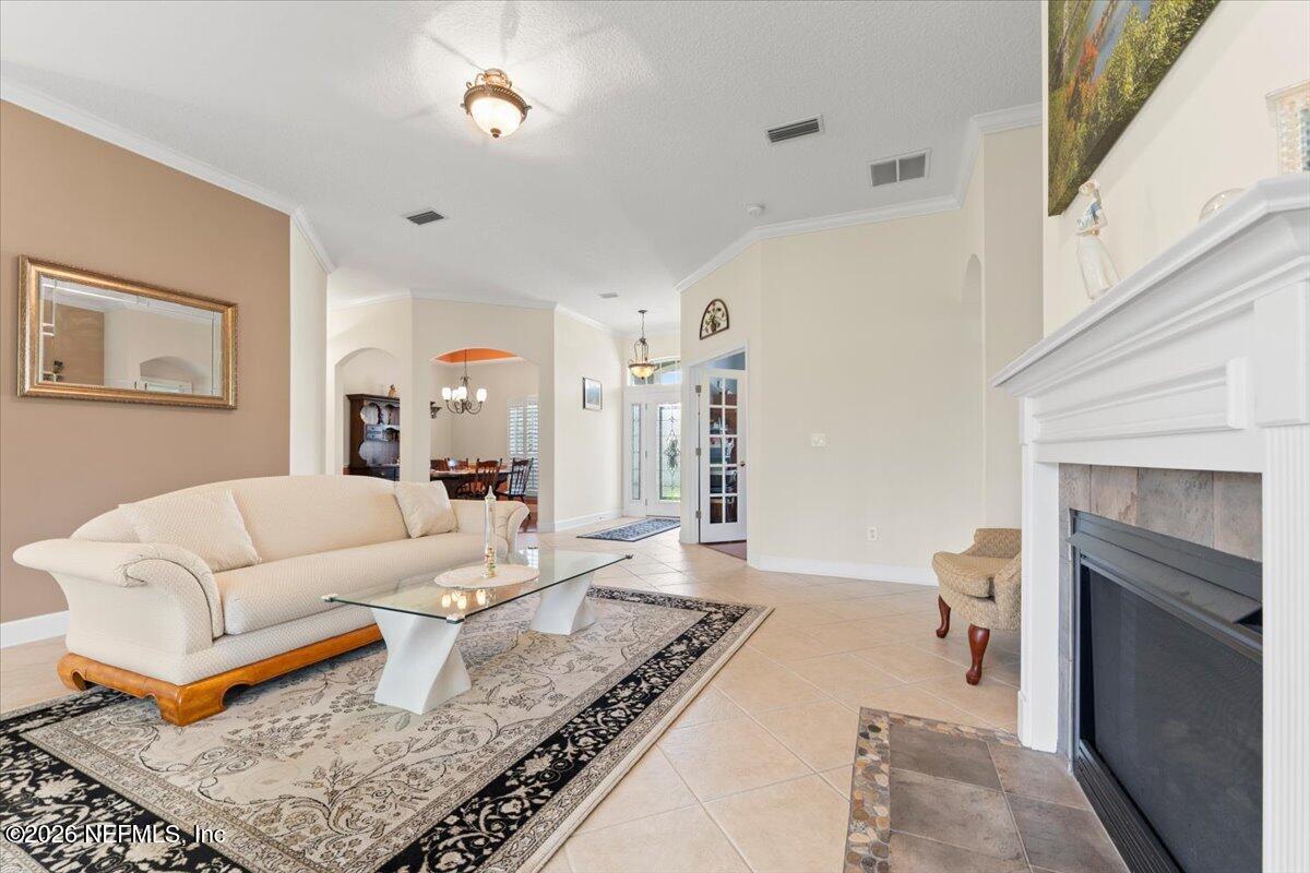 1112 Hawk Watch Circle St. Augustine, FL 32092 - Photo 12 of 49 a living room with furniture and a fireplace