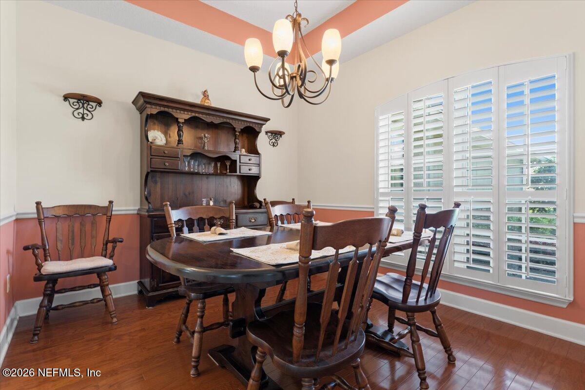 1112 Hawk Watch Circle St. Augustine, FL 32092 - Photo 14 of 49 a view of a dining room with furniture window and wooden floor