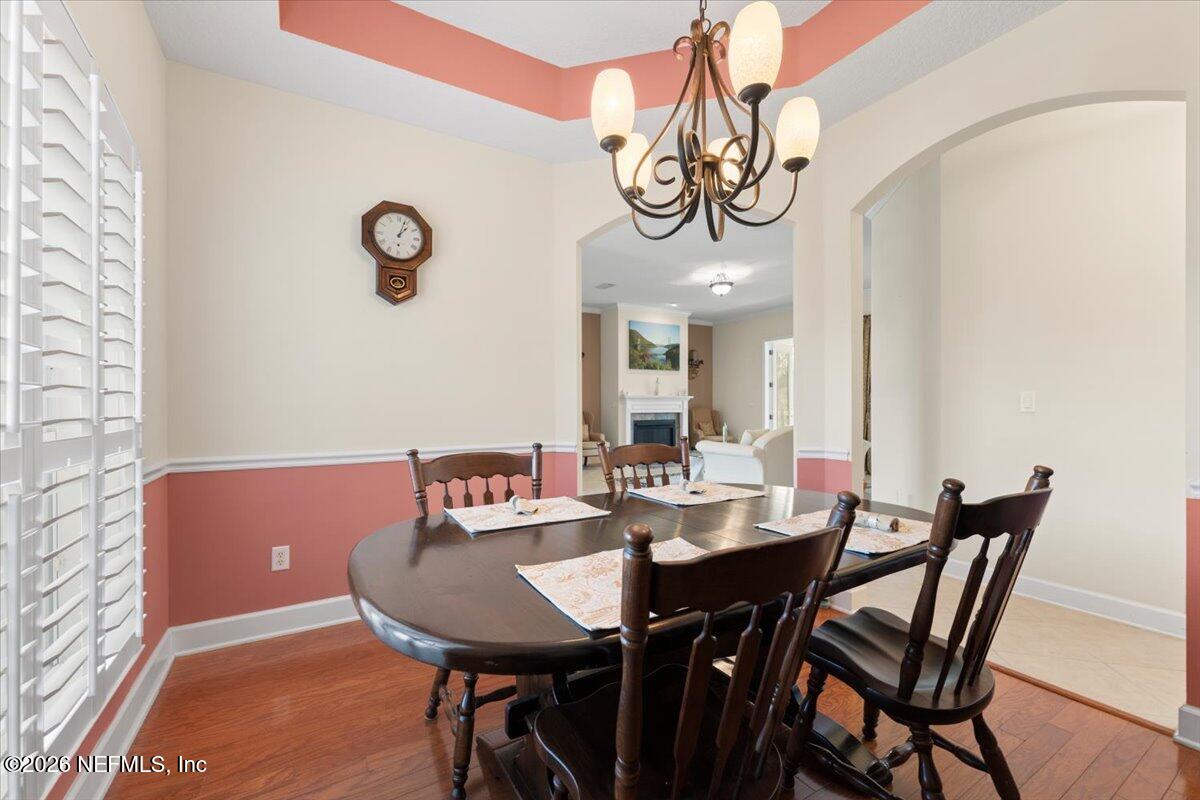 1112 Hawk Watch Circle St. Augustine, FL 32092 - Photo 15 of 49 a view of a dining room and a table and chairs in the room