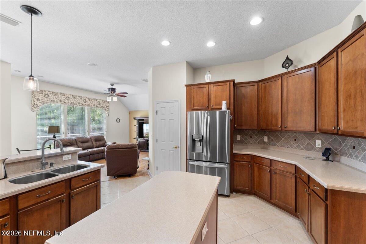 1112 Hawk Watch Circle St. Augustine, FL 32092 - Photo 19 of 49 a large kitchen with kitchen island a sink stainless steel appliances and cabinets