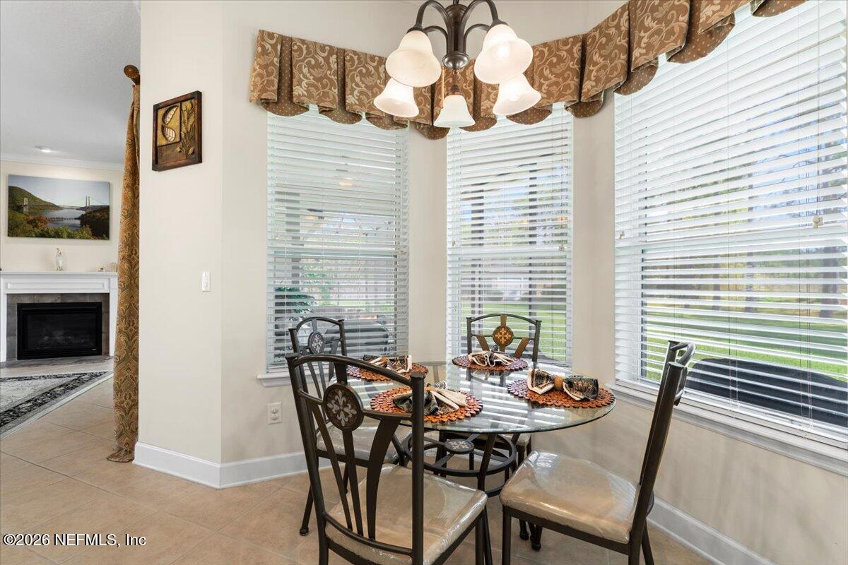 1112 Hawk Watch Circle St. Augustine, FL 32092 - Photo 20 of 49 a view of a dining room with furniture and window