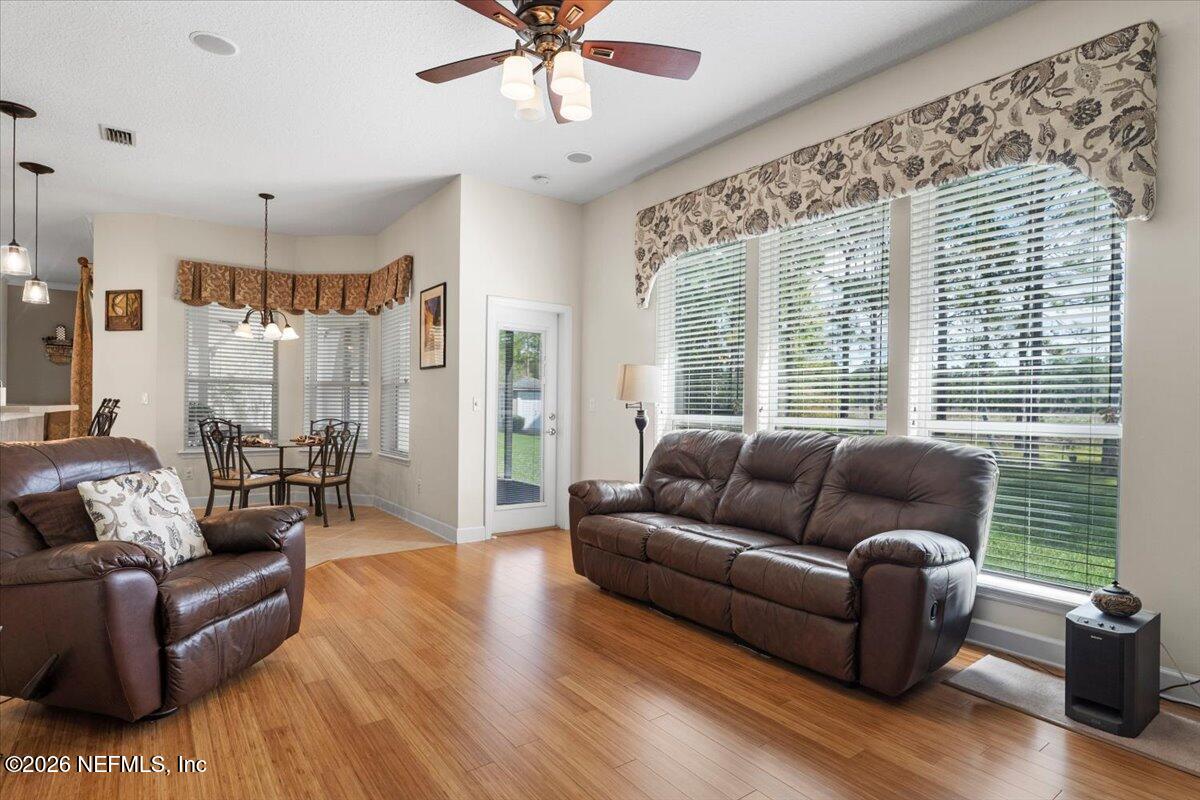 1112 Hawk Watch Circle St. Augustine, FL 32092 - Photo 23 of 49 a living room with furniture and a large window