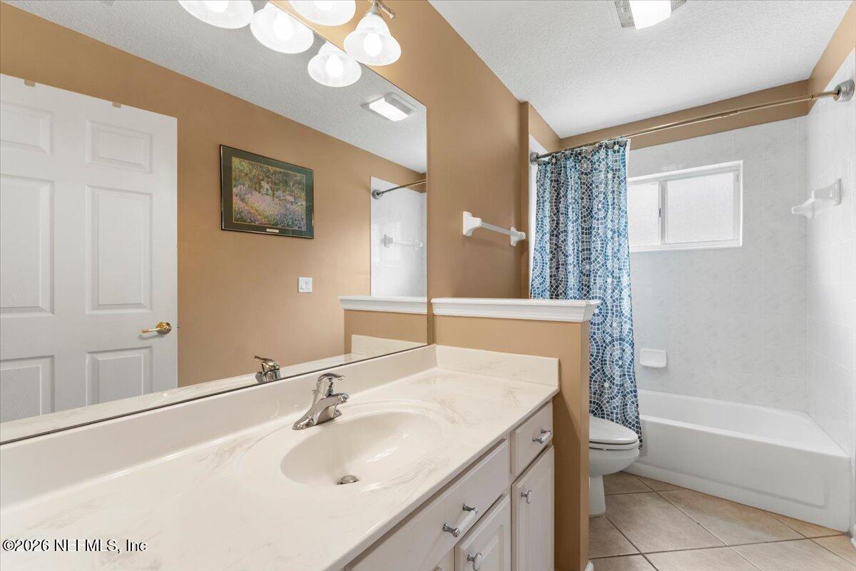 1112 Hawk Watch Circle St. Augustine, FL 32092 - Photo 27 of 49 a bathroom with a sink and a mirror