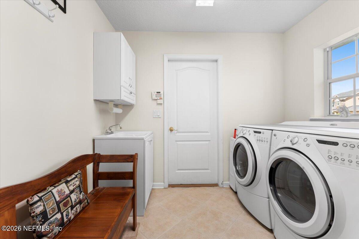 1112 Hawk Watch Circle St. Augustine, FL 32092 - Photo 30 of 49 a view of livingroom with washer and dryer