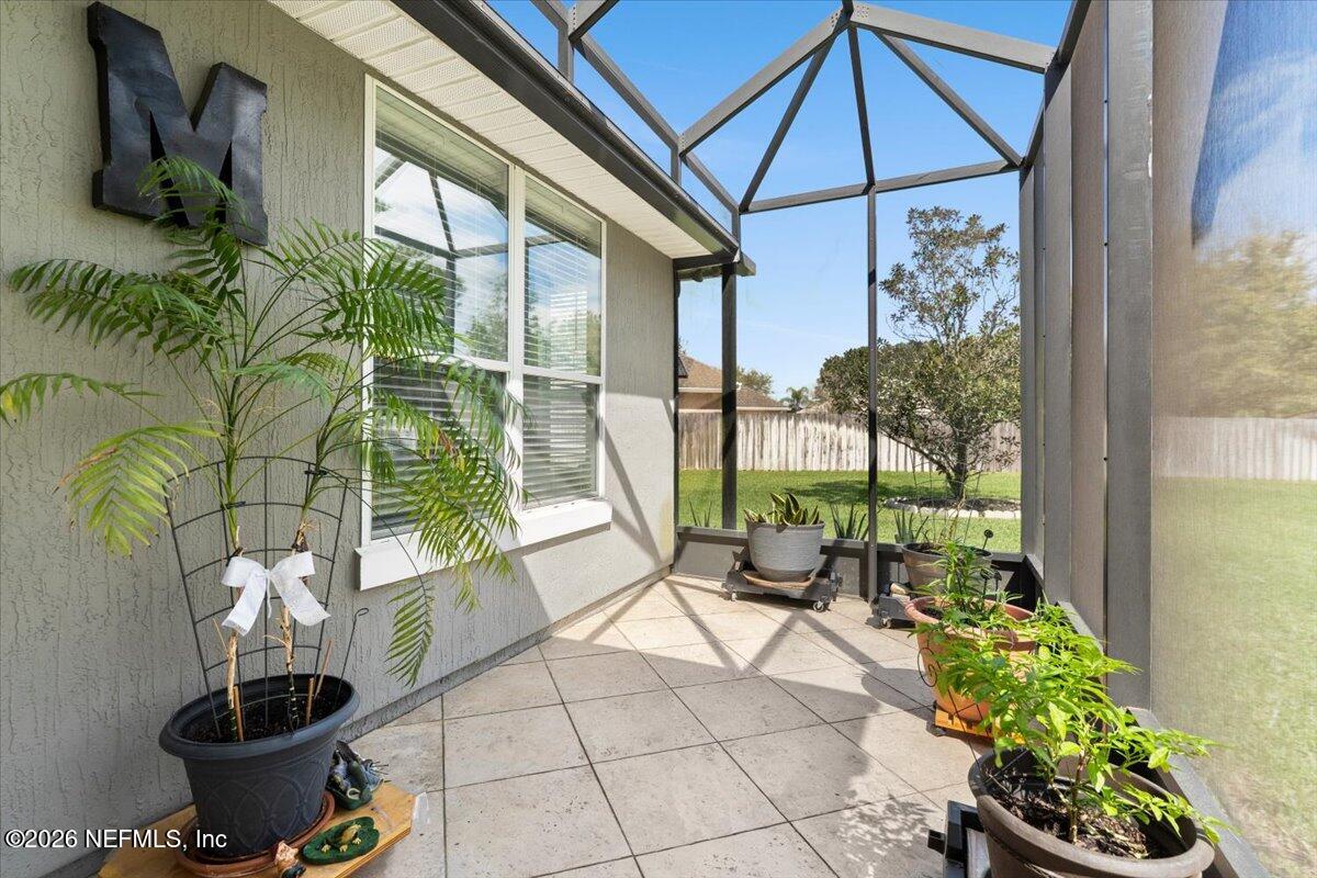 1112 Hawk Watch Circle St. Augustine, FL 32092 - Photo 32 of 49 a building outdoor space with patio furniture and potted plants