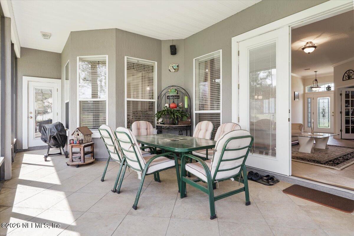 1112 Hawk Watch Circle St. Augustine, FL 32092 - Photo 33 of 49 a living room with furniture and a large window